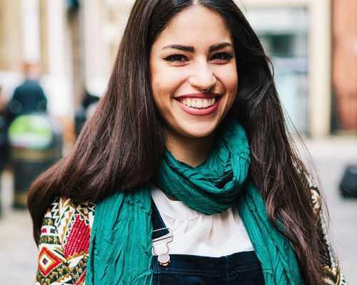 woman with long hair smiling