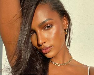 A close up of the model Jasmine Tookes with glowing sking