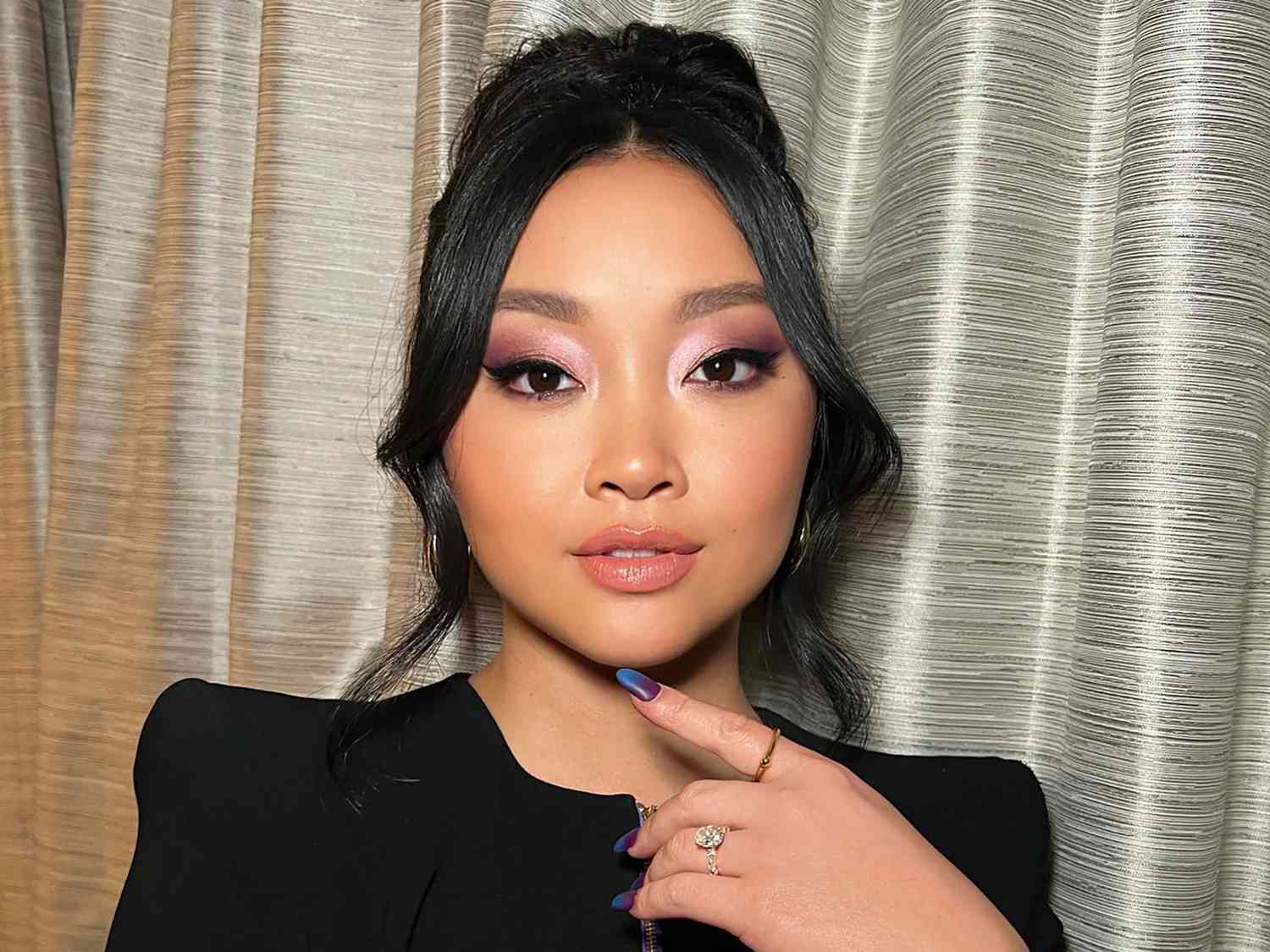 Close up of actor Lana Condor, purple eyeshadow bringing out her brown eyes