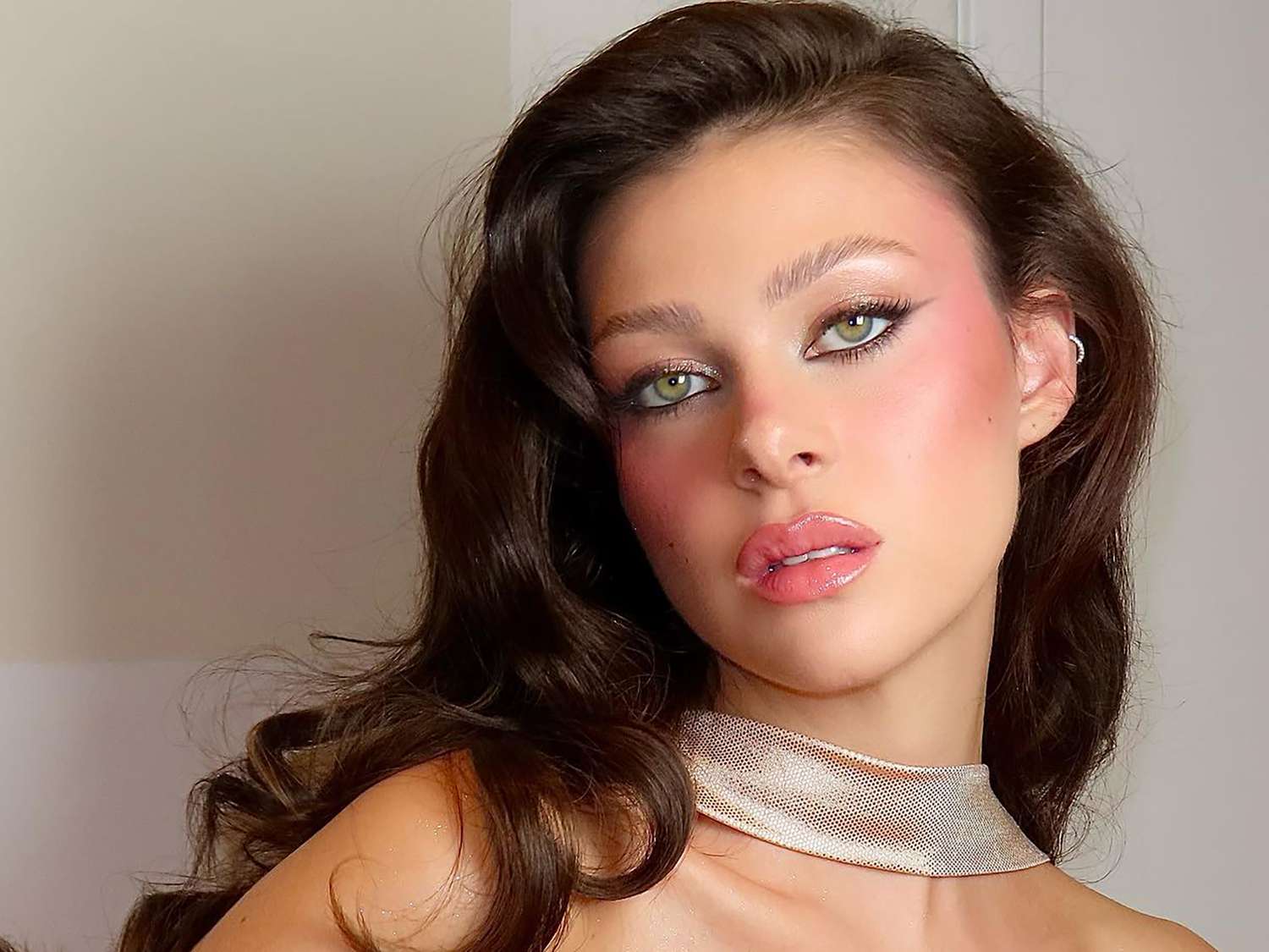 Close up of socialite Nicola Peltz Beckham wearing a blushy, glowy makeup look