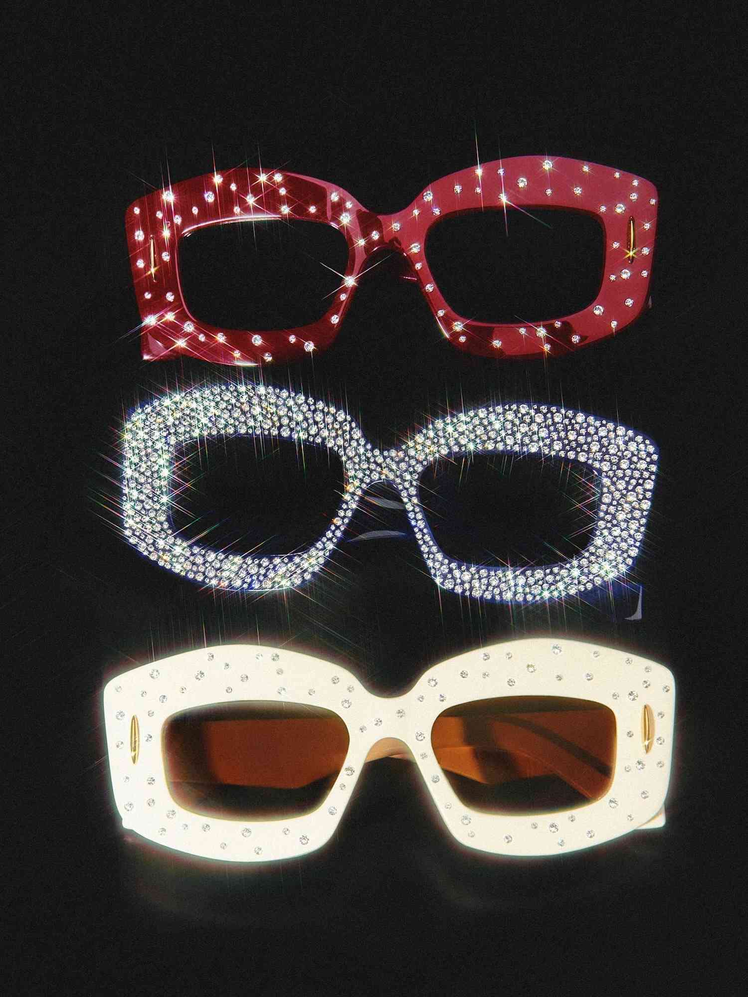 Rhinestone Loewe sunglasses in red, black, and white on black background