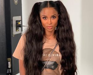 Ciara wears a voluminous, wavy high pigtails hairstyle and graphic tee