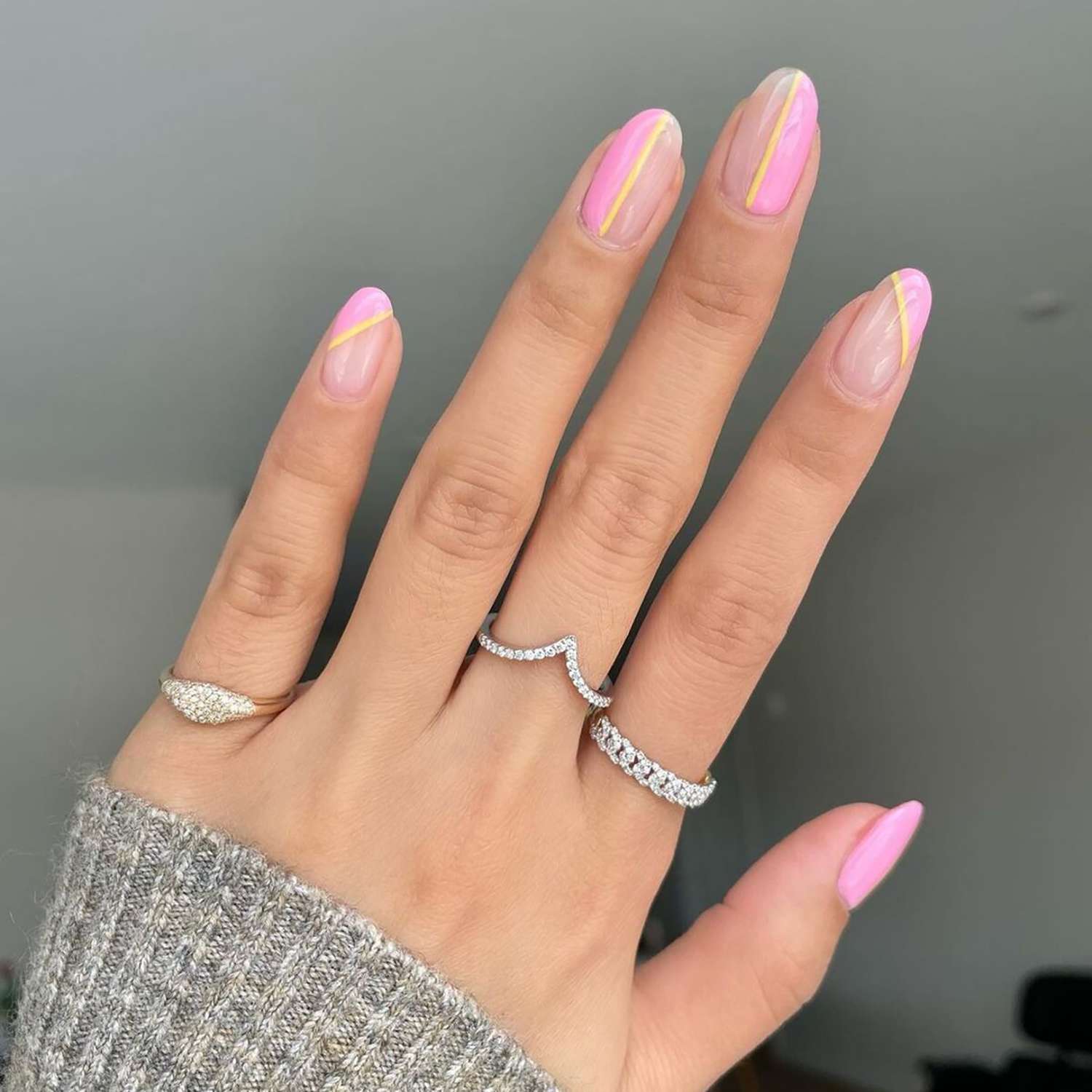 An abstract baby pink manicure