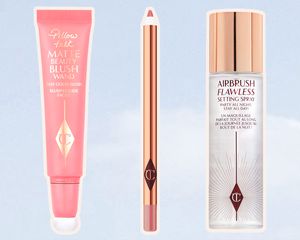 Assortment of the best Charlotte Tilbury products of 2023 displayed on a blue sky background 