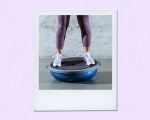 Woman balancing on a Bosu ball. 