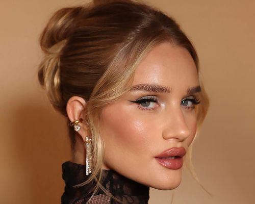 Rosie Huntington-Whitely in profile, head turned to the camera, with black winged eyeliner