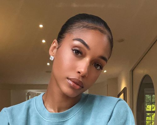 Close up of socialite Lori Harvey, her head slightly to the side