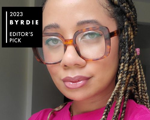 Byrdie editor Eden Stuart with glossy lips, tortoiseshell glasses, and a radiant makeup look