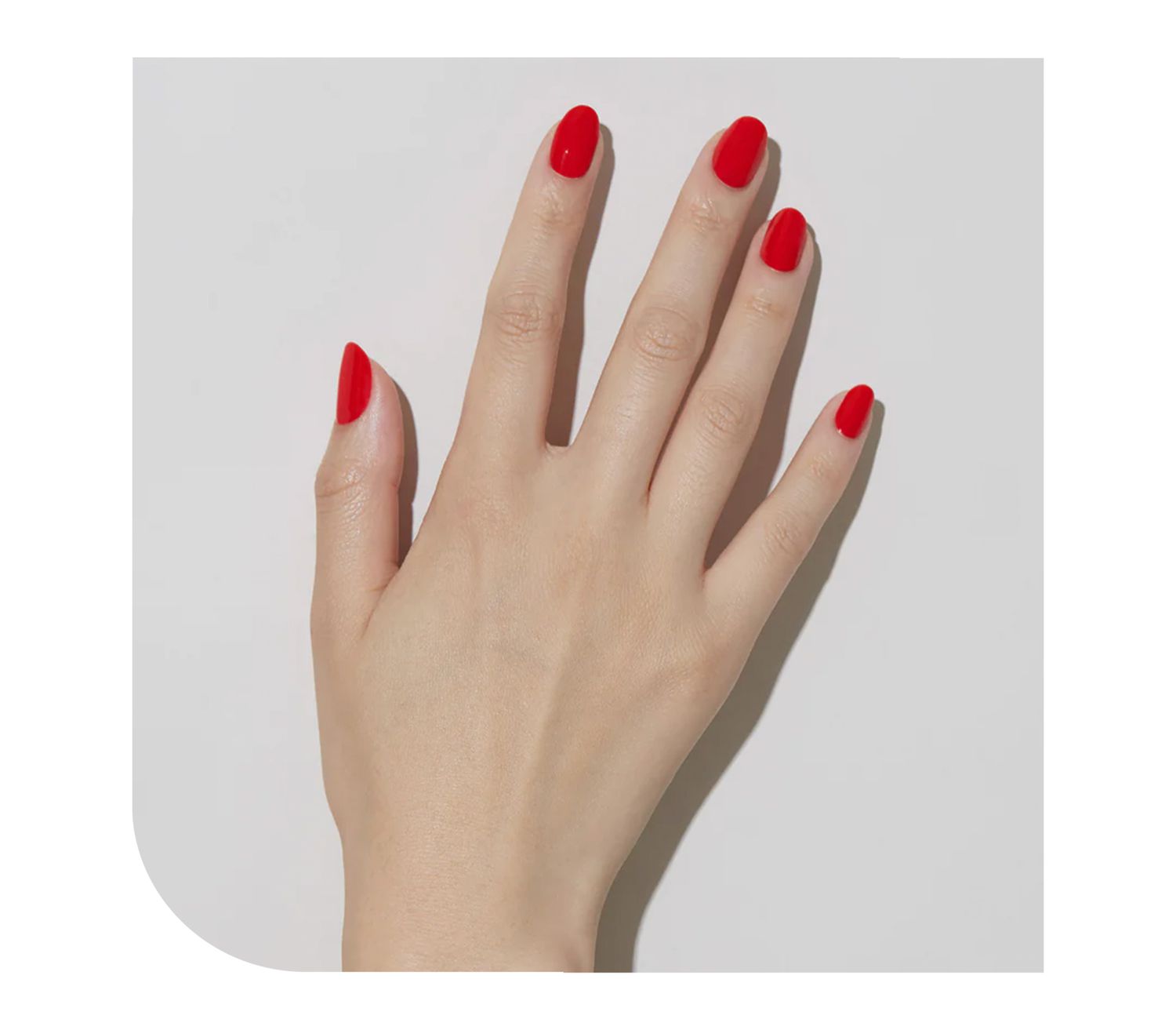 Model wearing bright red nails