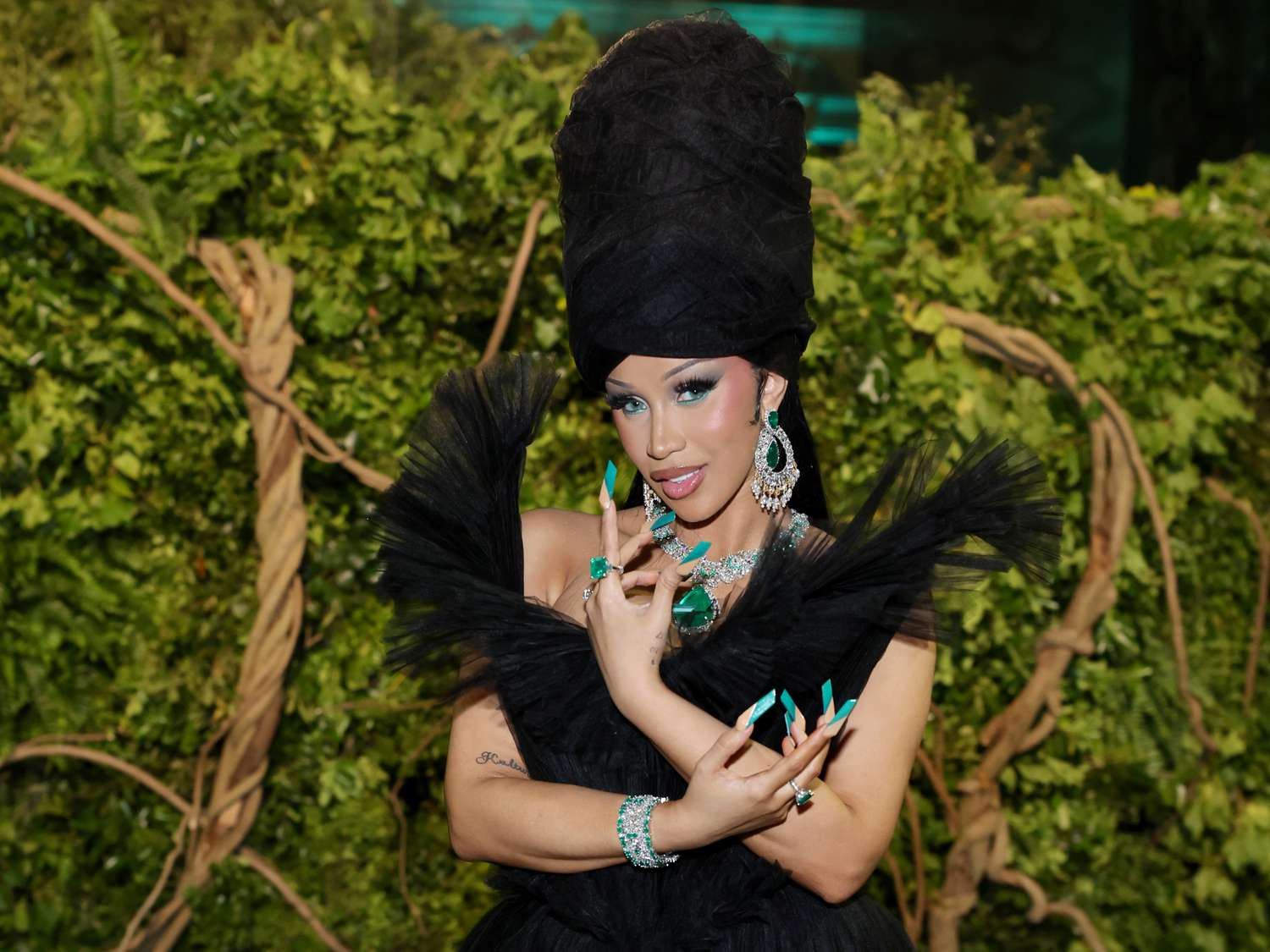 Cardi B at the 2024 Met Gala in a large headwrap