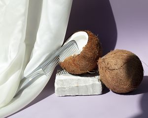 coconut oil cracked open with a comb