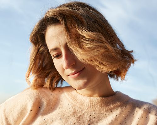 Portrait of blond woman in sunlight