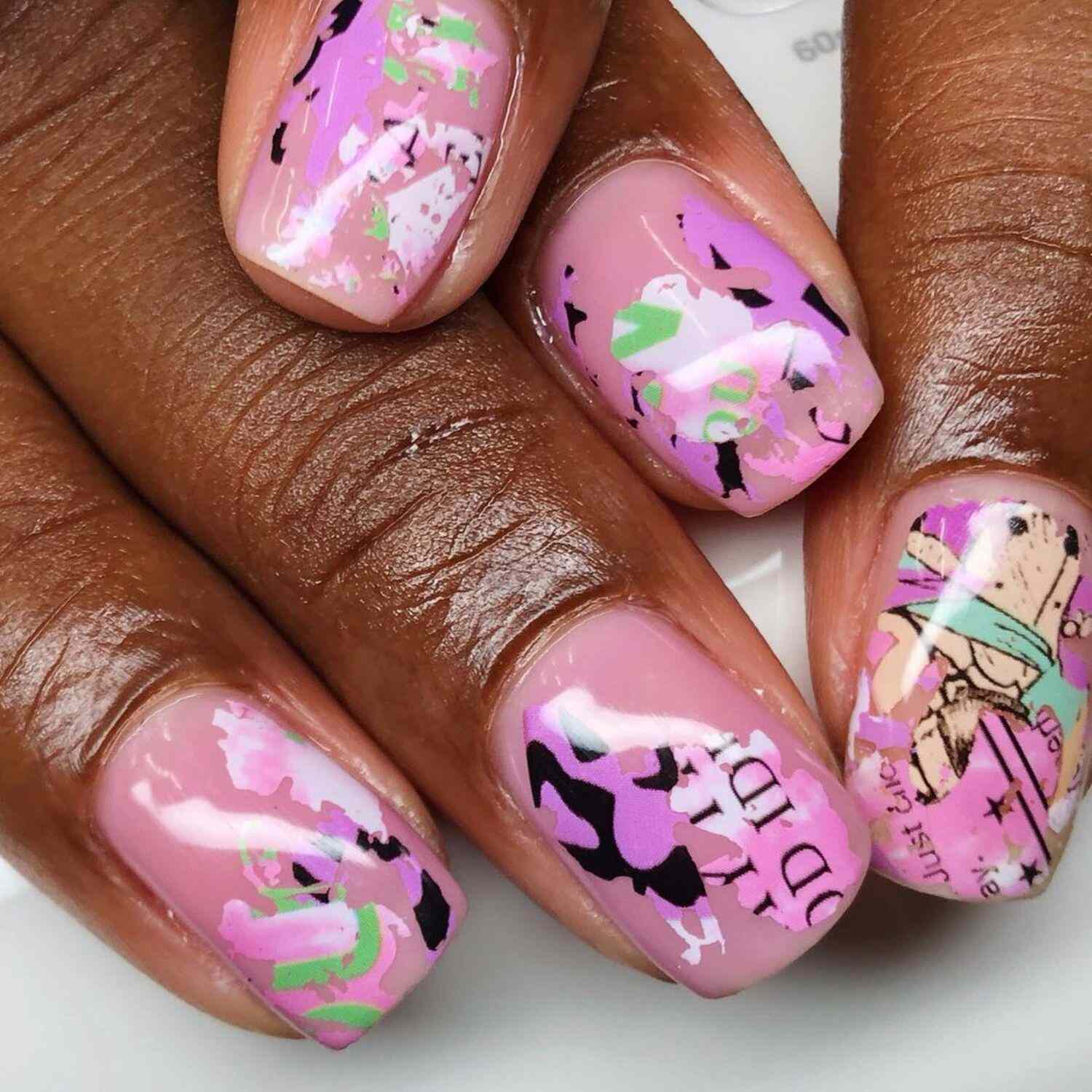 A baby pink manicure with abstract fine art details