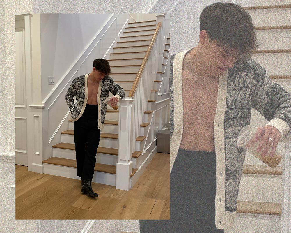 Noah Beck in front of stairs unbuttoned cardigan