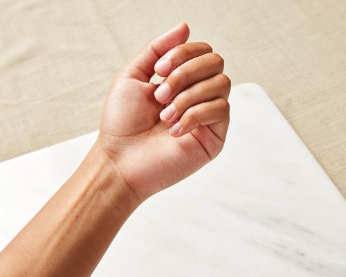 Close up of a hand with filed nails