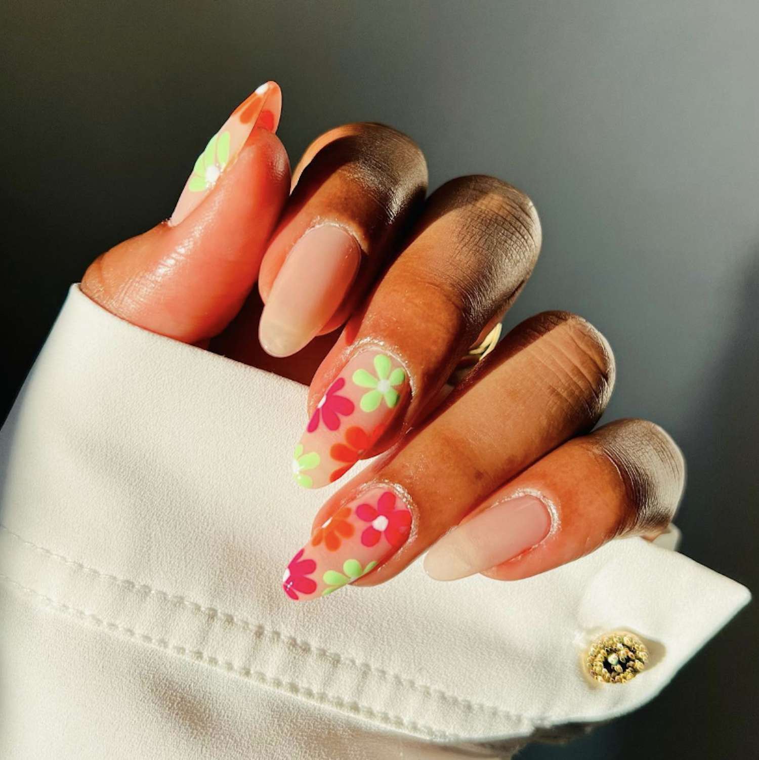 Flower design on pink nails