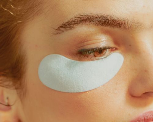 Young Woman Wearing an Undereye Mask