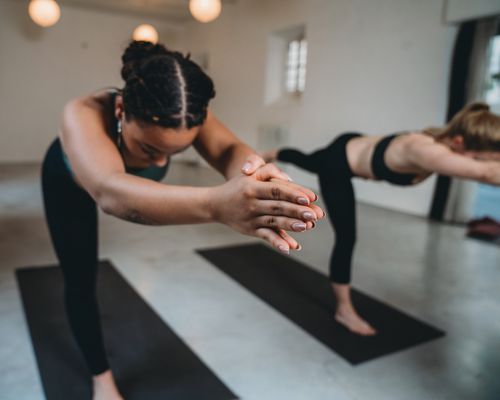 women taking hot yoga class