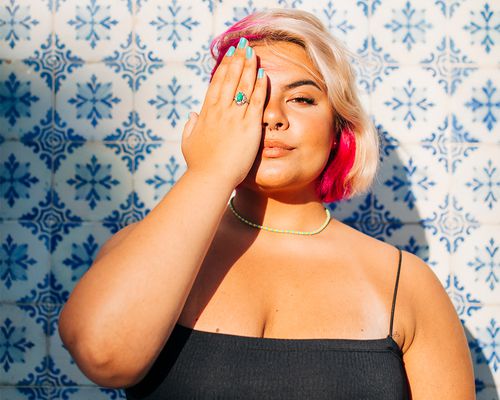 latina with pink hair in the sun