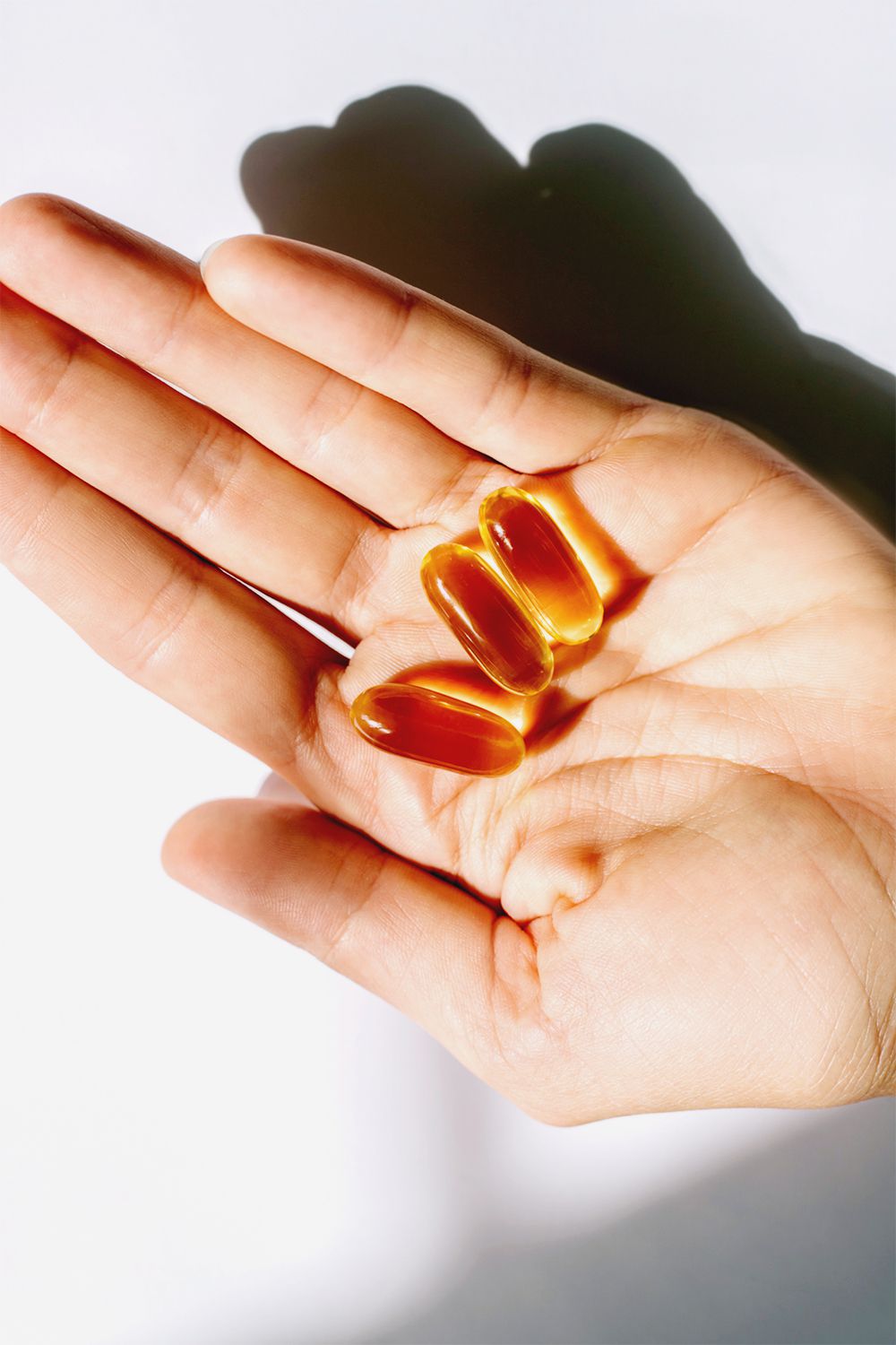 vitamin b12 capsules in hand