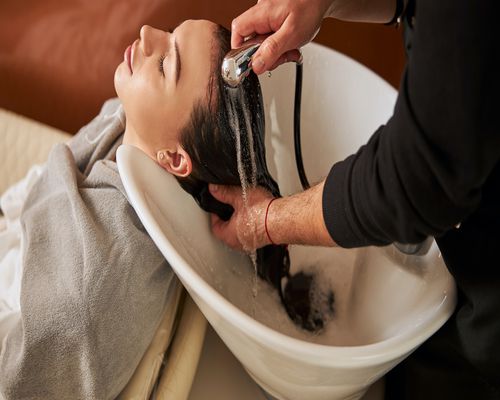 Woman having her hair washed