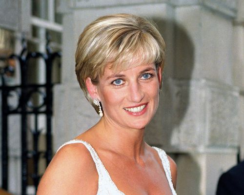 Princess Diana wears a long pixie cut with highlighted bangs and pearl drop earrings