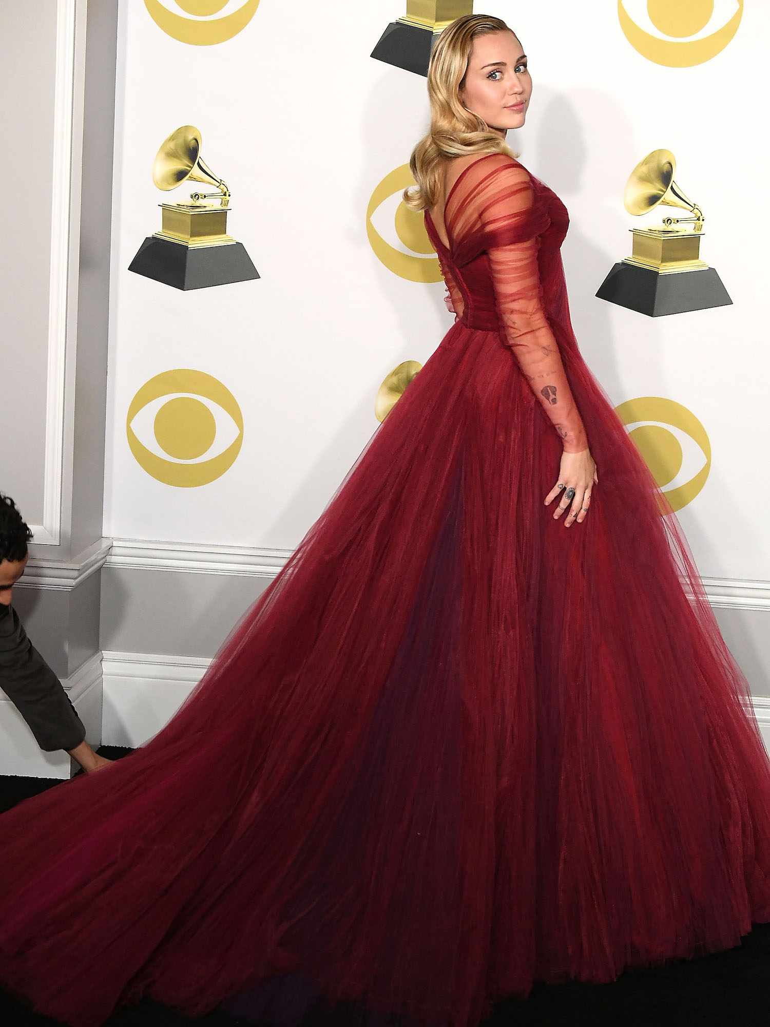 Miley Cyrus wears a red tulle Zac Posen gown to the 2018 Grammy Awards