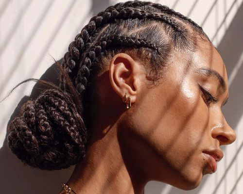 Woman with braids in bun.