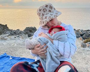 Halsey and her baby on the beach