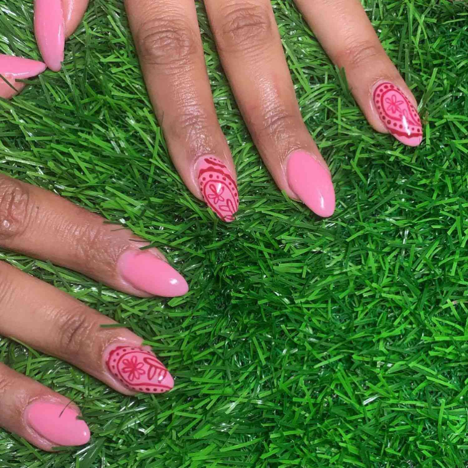 A baby pink French manicure with henna accent nails