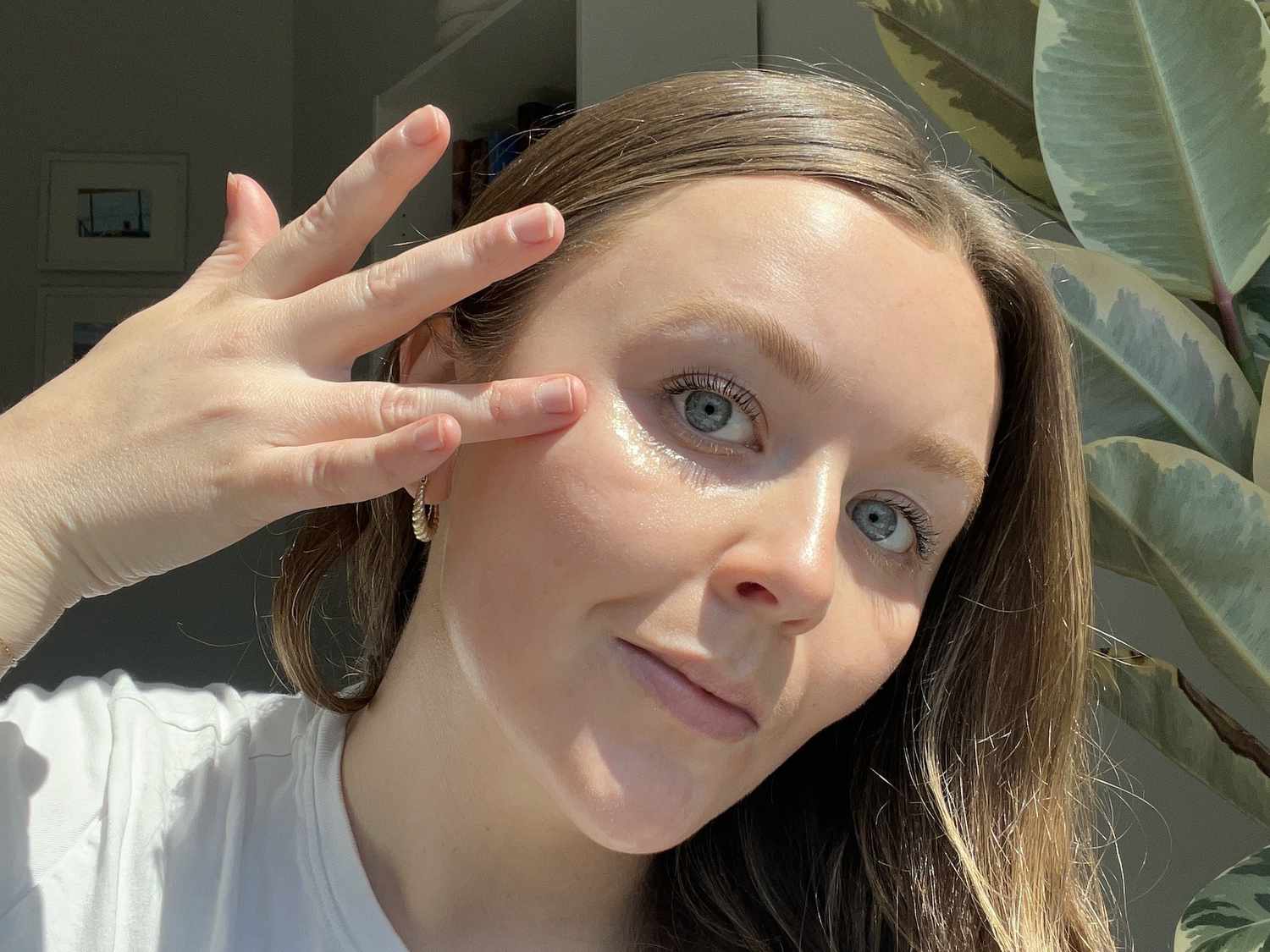 woman applying eye gel to under-eye area