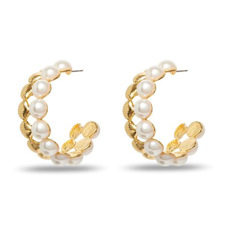 gold pearl hoop earrings on white background