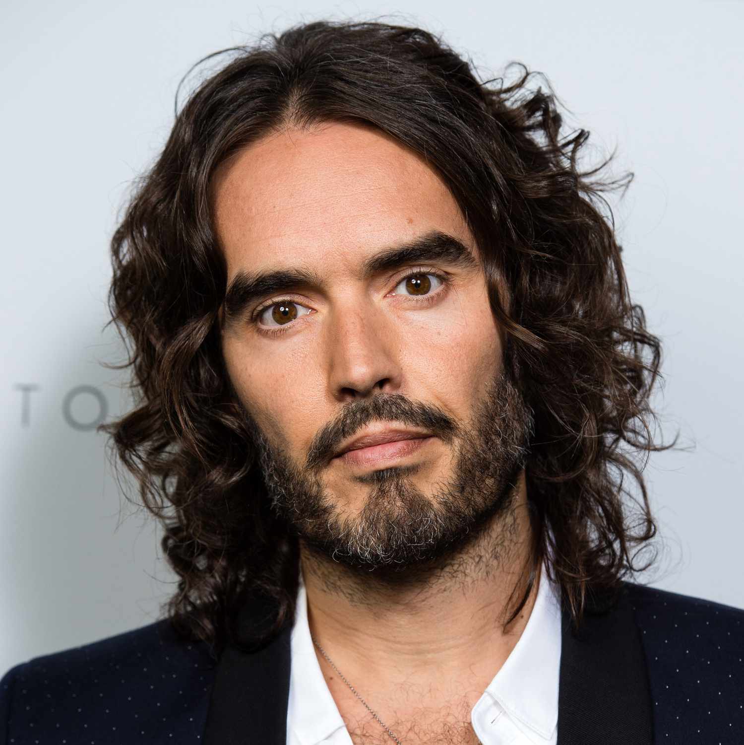 long hairstyles for men - russell brand