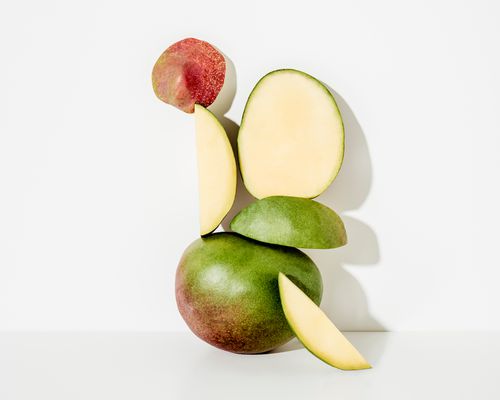 mangos stacked on white background