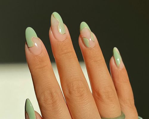 A green and negative space manicure