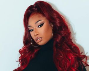 Megan Thee Stallion with cherry coke red hair