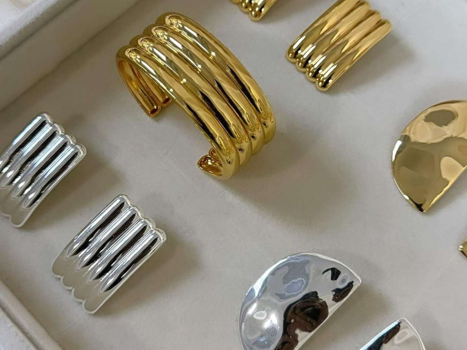 Silver and gold rings in jewelry box