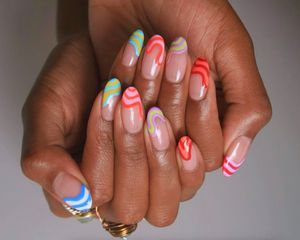 Almond-shaped nude nails with neon rainbow tips with a melting effect