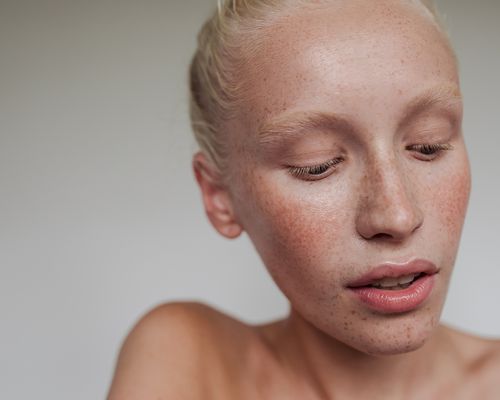 Close up of a woman with flushed cheeks