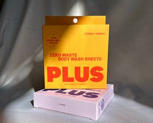 Plus Body Wash Sheets Travel Packs on gray fabric