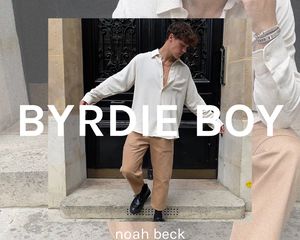 Noah Beck outside white shirt tan pants