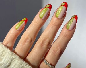 A green glittery art-deco inspired manicure with abstract red French tips