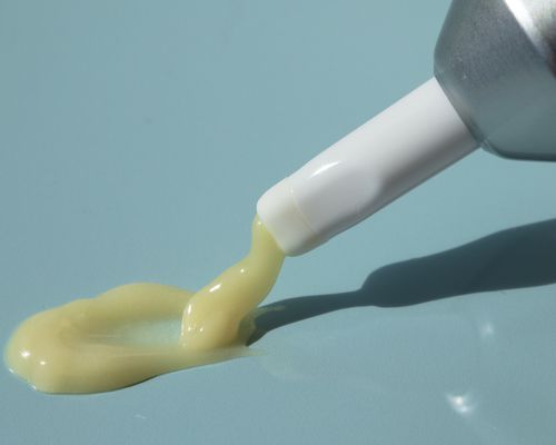 close up of retinol texture on blue background