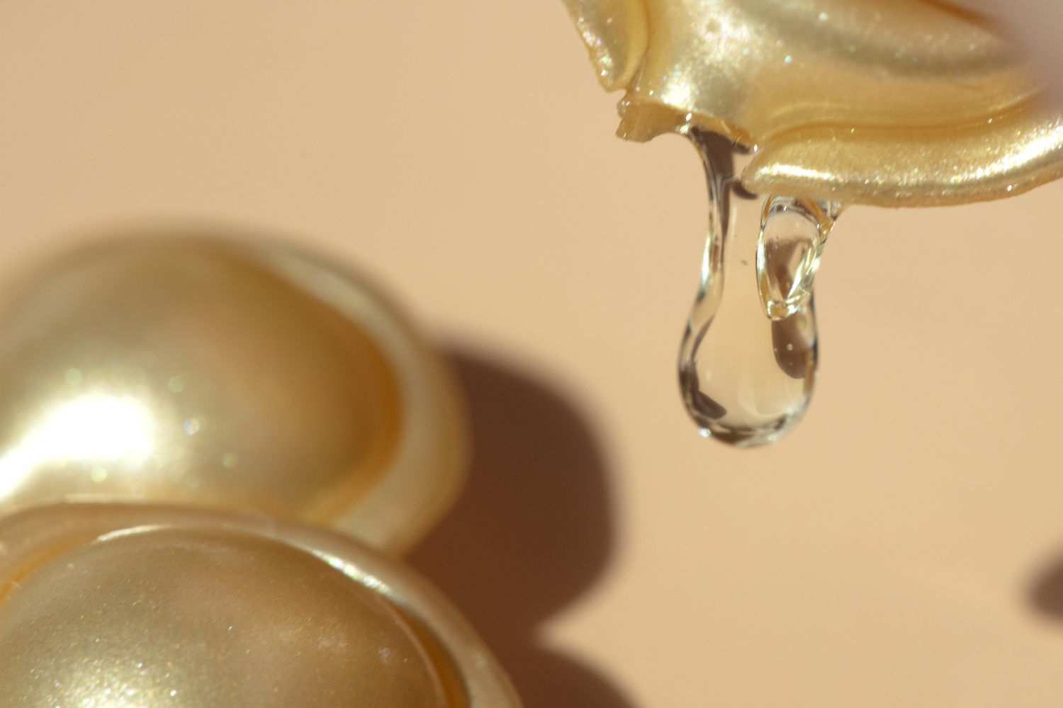 Close up of a cracked retinyl palmitate capsule