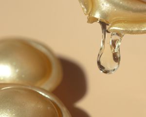 Close up of a cracked retinyl palmitate capsule