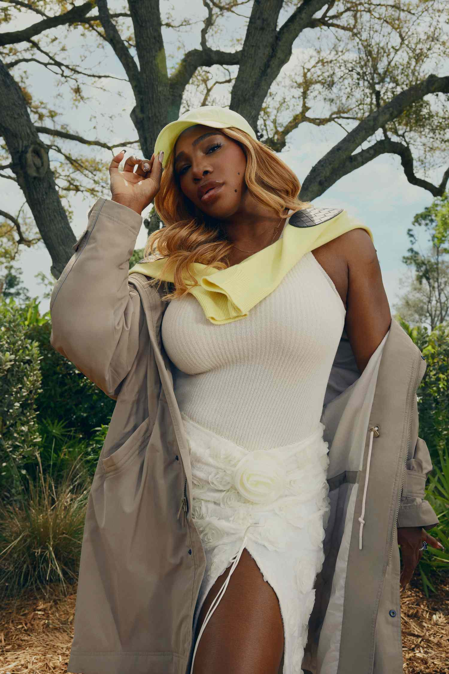 Serena Williams in a White Floral Skirt White Tank Top Yellow Baseball Hat