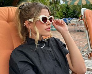 Sofia Richie Grainge wearing sunglasses by the pool