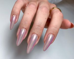 A long stiletto pink chrome manicure