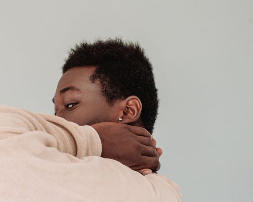 Close up of a man with his head on his neck, his hair in view