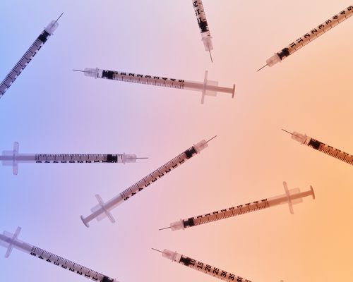 Syringes on a gradient background